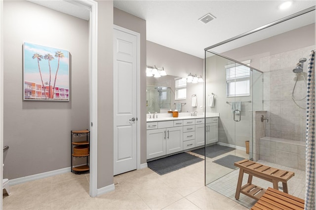 9203 SW 97th Cir, Ocala, FL 34481 - bathroom with a stall shower, double vanity, baseboards, and tile patterned flooring