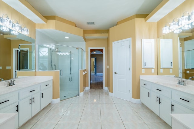 5815 NE 70th St, Silver Springs, FL 34488 - bathroom featuring a shower stall, two vanities, and baseboards