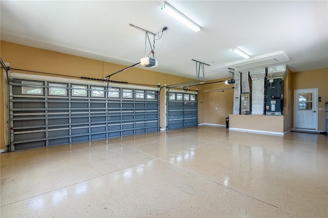 5815 NE 70th St, Silver Springs, FL 34488 - garage featuring a garage door opener, heating unit, and baseboards