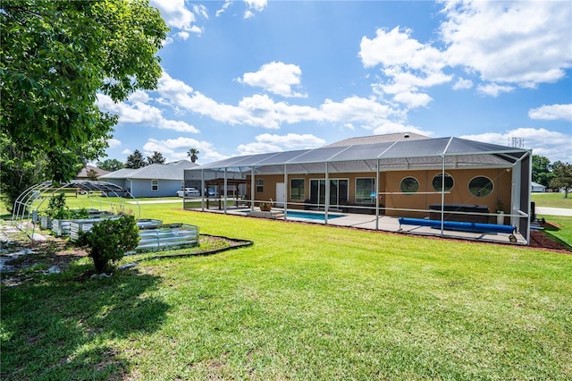 5815 NE 70th St, Silver Springs, FL 34488 - rear view of house featuring an outdoor pool, a lawn, a patio, glass enclosure, and stucco siding
