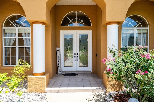 5815 NE 70th St, Silver Springs, FL 34488 - doorway to property with french doors and stucco siding