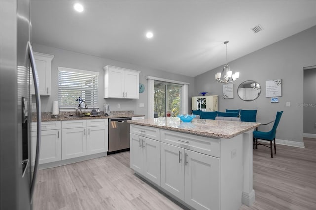 9805 N Dana Way, Citrus Springs, FL 34433 - kitchen featuring appliances with stainless steel finishes, lofted ceiling, light wood-style flooring, healthy amount of natural light, and recessed lighting