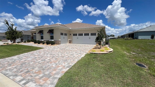 10287 SW 96th Ln, Ocala, FL 34481 - view of front of home featuring stucco siding, a garage, a front yard, and decorative driveway