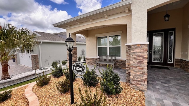 10287 SW 96th Ln, Ocala, FL 34481 - view of exterior entry featuring stucco siding, stone siding, and a porch