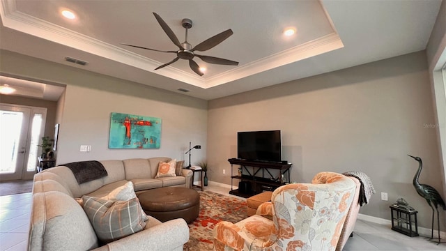 10287 SW 96th Ln, Ocala, FL 34481 - living area featuring a raised ceiling, ornamental molding, a ceiling fan, baseboards, and light tile patterned floors