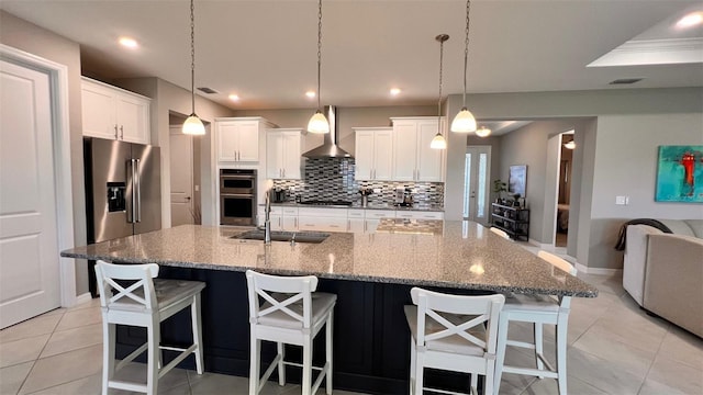 10287 SW 96th Ln, Ocala, FL 34481 - kitchen with a sink, appliances with stainless steel finishes, wall chimney range hood, decorative backsplash, and baseboards