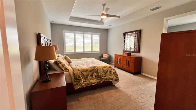 10287 SW 96th Ln, Ocala, FL 34481 - bedroom featuring light colored carpet, a tray ceiling, ceiling fan, and baseboards