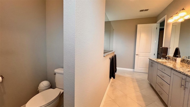 10287 SW 96th Ln, Ocala, FL 34481 - bathroom featuring toilet, double vanity, and tile patterned floors