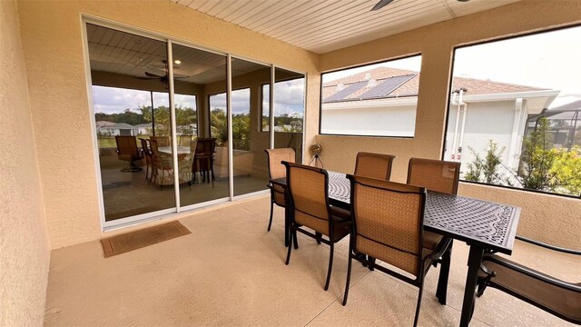 10287 SW 96th Ln, Ocala, FL 34481 - sunroom / solarium featuring a textured wall, a ceiling fan, outdoor dining space, and healthy amount of natural light