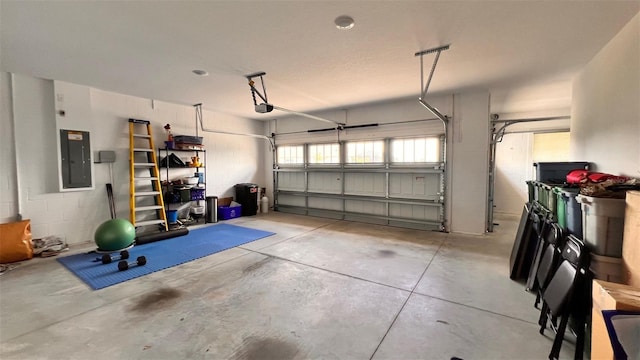 10287 SW 96th Ln, Ocala, FL 34481 - garage featuring electric panel and a garage door opener