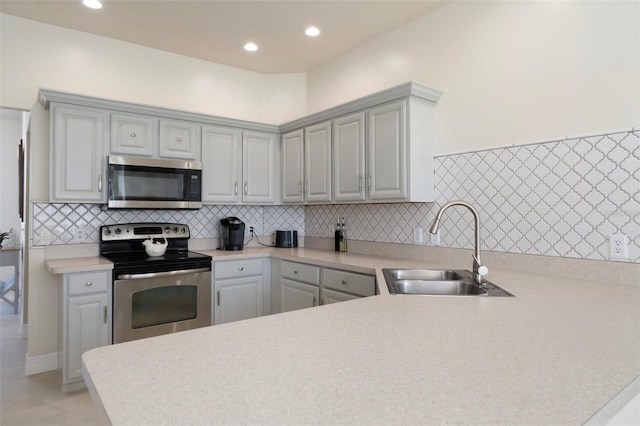 4731 N Crestline Dr, Beverly Hills, FL 34465 - kitchen featuring appliances with stainless steel finishes, light countertops, tasteful backsplash, a peninsula, and recessed lighting