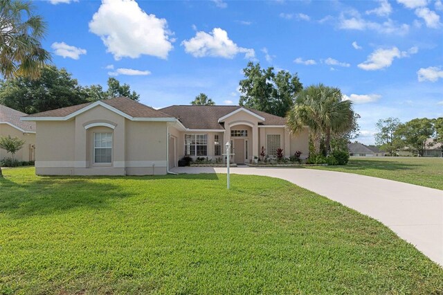 4731 N Crestline Dr, Beverly Hills, FL 34465 - ranch-style home featuring driveway, stucco siding, a front lawn, and a shingled roof