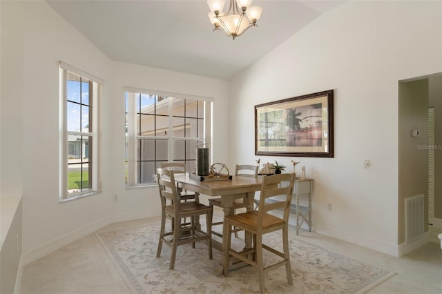 4731 N Crestline Dr, Beverly Hills, FL 34465 - dining space with healthy amount of natural light, a chandelier, lofted ceiling, and light tile patterned flooring