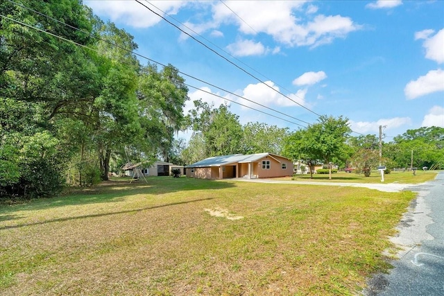 1322 NE 53rd St, Ocala, FL 34479 - view of front of home featuring a front lawn