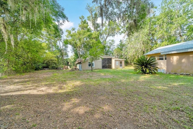 1322 NE 53rd St, Ocala, FL 34479 - view of green lawn with an outdoor structure