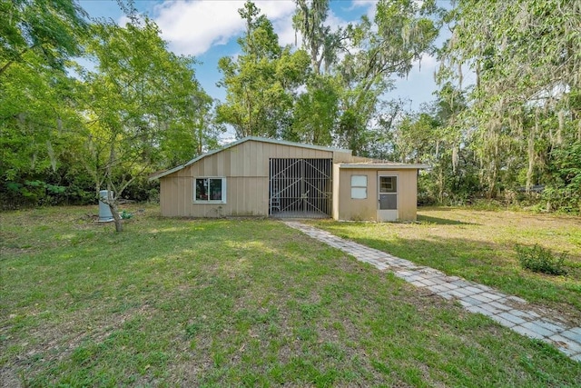 1322 NE 53rd St, Ocala, FL 34479 - view of pole building with a lawn