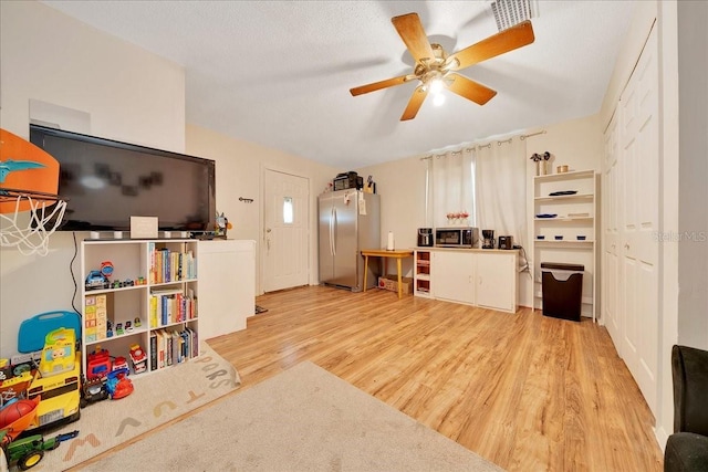 1322 NE 53rd St, Ocala, FL 34479 - living room featuring light wood-style flooring and a ceiling fan