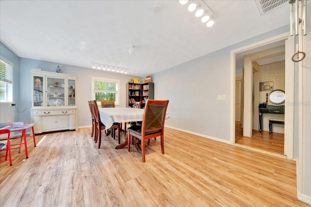 1322 NE 53rd St, Ocala, FL 34479 - dining area with light wood-style floors and baseboards