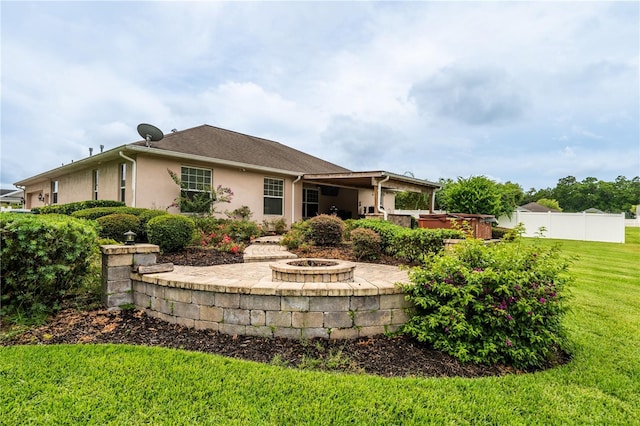 4015 SE 22nd St, Ocala, FL 34471 - rear view of house with a fire pit, a patio, a hot tub, and stucco siding