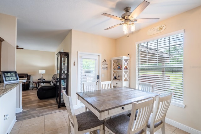 4015 SE 22nd St, Ocala, FL 34471 - dining space with ceiling fan, light tile patterned floors, and baseboards