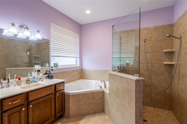 4015 SE 22nd St, Ocala, FL 34471 - bathroom featuring a walk in shower, a bath, vanity, and tile patterned floors