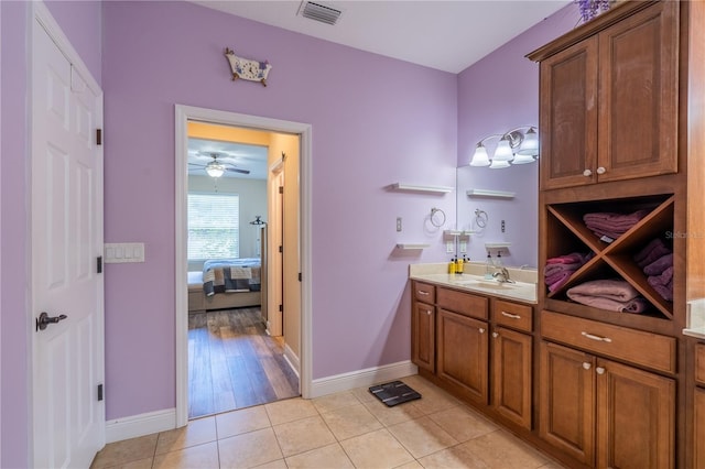 4015 SE 22nd St, Ocala, FL 34471 - bathroom featuring connected bathroom, vanity, baseboards, and tile patterned flooring