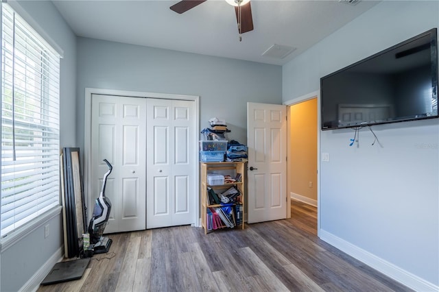 4015 SE 22nd St, Ocala, FL 34471 - bedroom with a closet, wood finished floors, and baseboards