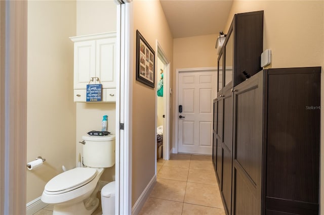 4015 SE 22nd St, Ocala, FL 34471 - bathroom featuring toilet, tile patterned flooring, and baseboards