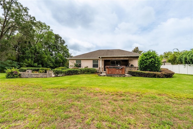 4015 SE 22nd St, Ocala, FL 34471 - rear view of property with a hot tub and stucco siding