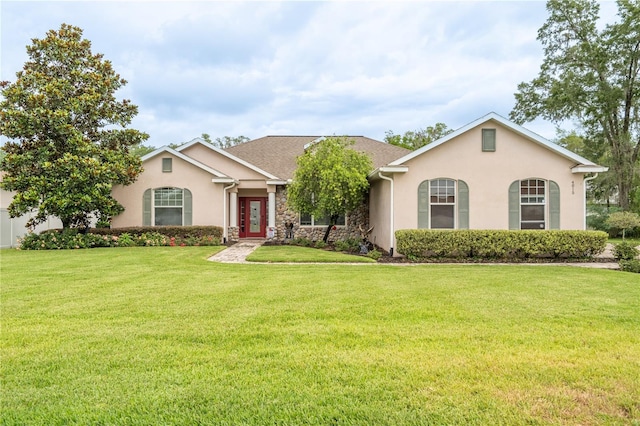 4015 SE 22nd St, Ocala, FL 34471 - view of front facade with stucco siding, a front yard, and stone siding