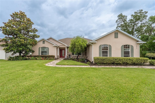 4015 SE 22nd St, Ocala, FL 34471 - view of front of house featuring stucco siding and a front lawn