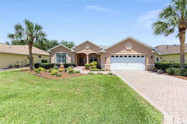 8303 SW 82nd Cir, Ocala, FL 34481 - single story home featuring stucco siding, an attached garage, decorative driveway, and a front lawn