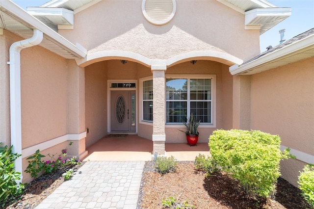 8303 SW 82nd Cir, Ocala, FL 34481 - property entrance with stucco siding and covered porch