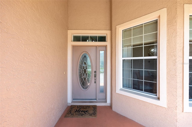 8303 SW 82nd Cir, Ocala, FL 34481 - doorway to property featuring stucco siding