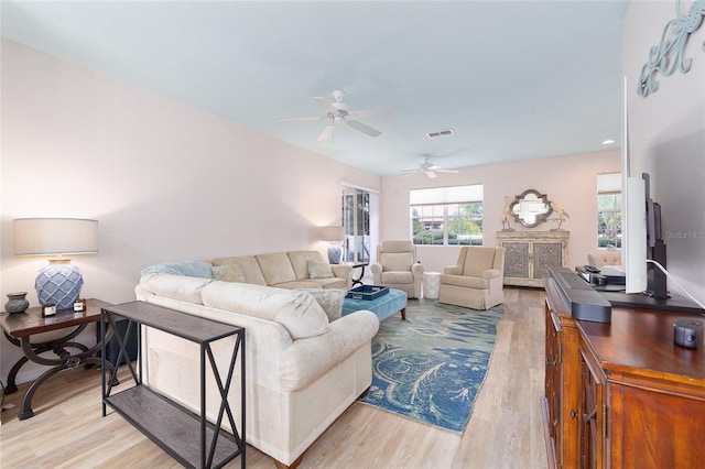 8303 SW 82nd Cir, Ocala, FL 34481 - living room featuring light wood-style floors and ceiling fan