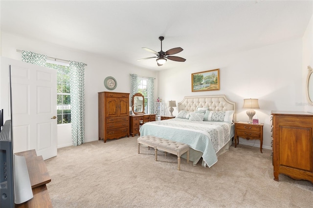 8303 SW 82nd Cir, Ocala, FL 34481 - bedroom featuring light carpet, baseboards, and ceiling fan