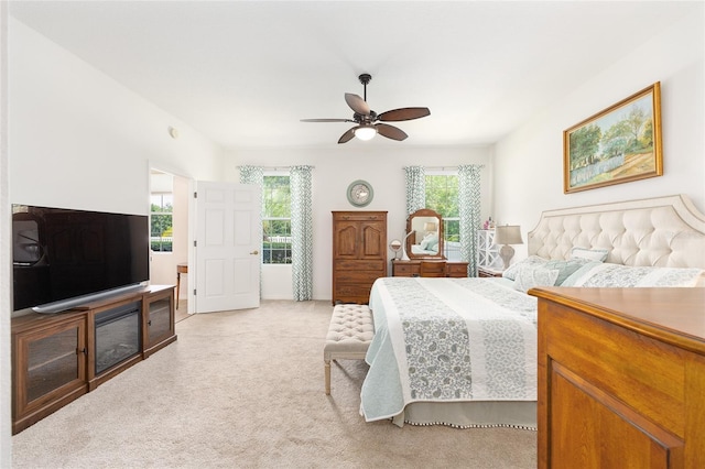 8303 SW 82nd Cir, Ocala, FL 34481 - bedroom with multiple windows, light colored carpet, and a ceiling fan