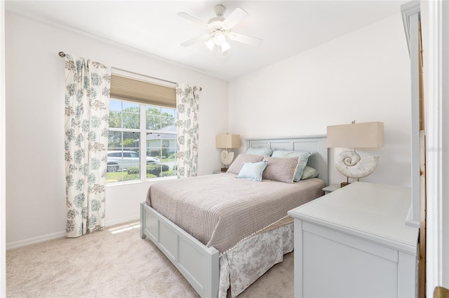 8303 SW 82nd Cir, Ocala, FL 34481 - bedroom with light carpet, baseboards, and a ceiling fan