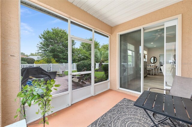 8303 SW 82nd Cir, Ocala, FL 34481 - sunroom / solarium with ceiling fan and outdoor dining space