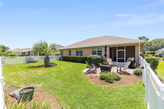 8303 SW 82nd Cir, Ocala, FL 34481 - back of property featuring an outdoor fire pit, a patio area, and a sunroom