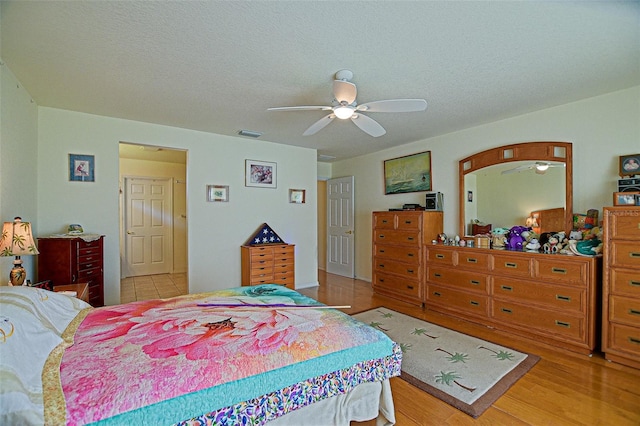 13863 SE 85th Cir, Summerfield, FL 34491 - bedroom with ceiling fan and light wood-type flooring