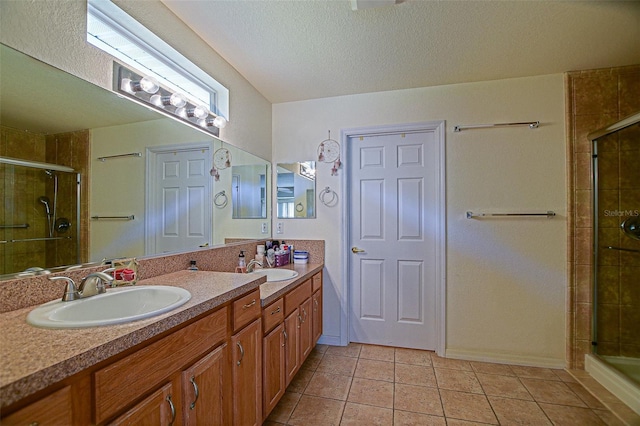 13863 SE 85th Cir, Summerfield, FL 34491 - bathroom featuring a stall shower, double vanity, tile patterned flooring, and a textured ceiling