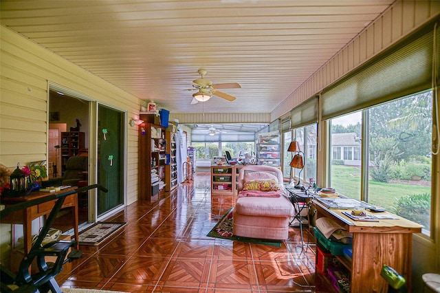 13863 SE 85th Cir, Summerfield, FL 34491 - sunroom / solarium with a ceiling fan and wooden walls