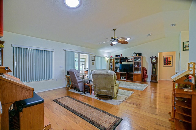 13863 SE 85th Cir, Summerfield, FL 34491 - living room featuring vaulted ceiling, ceiling fan, and hardwood / wood-style floors