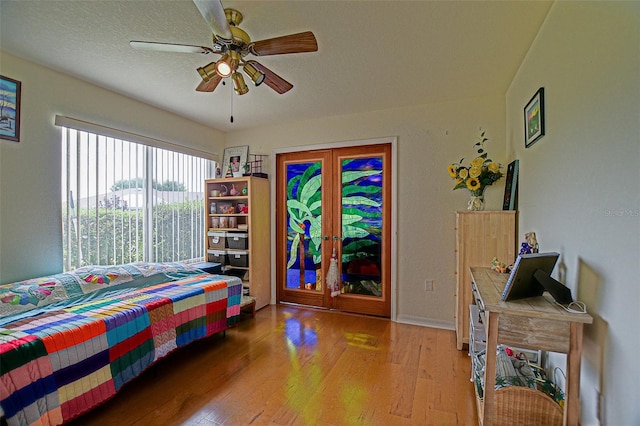13863 SE 85th Cir, Summerfield, FL 34491 - bedroom with light wood-type flooring, ceiling fan, baseboards, and access to outside