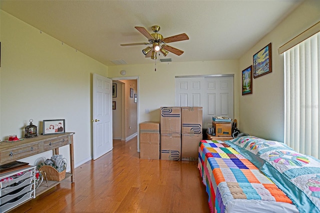 13863 SE 85th Cir, Summerfield, FL 34491 - bedroom with wood finished floors, a ceiling fan, and a closet