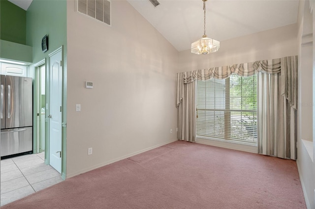 11 Calendula Ct E, Homosassa, FL 34446 - empty room with high vaulted ceiling, light carpet, a chandelier, and light tile patterned floors