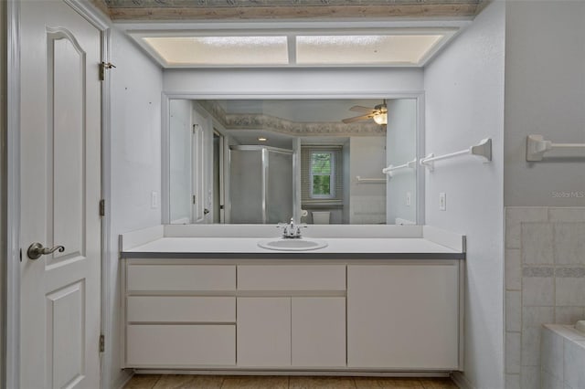 11 Calendula Ct E, Homosassa, FL 34446 - full bathroom featuring vanity, a shower stall, and ceiling fan