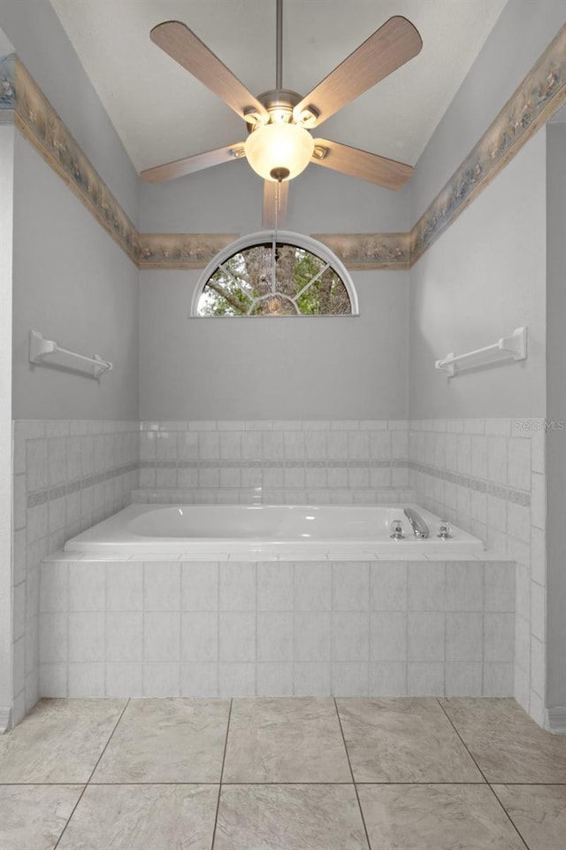 11 Calendula Ct E, Homosassa, FL 34446 - full bath with tile patterned floors, a bath, lofted ceiling, and ceiling fan