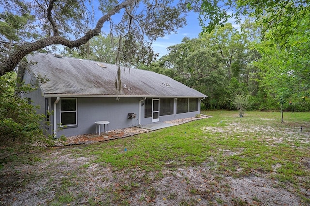 11 Calendula Ct E, Homosassa, FL 34446 - rear view of house featuring a sunroom and a yard